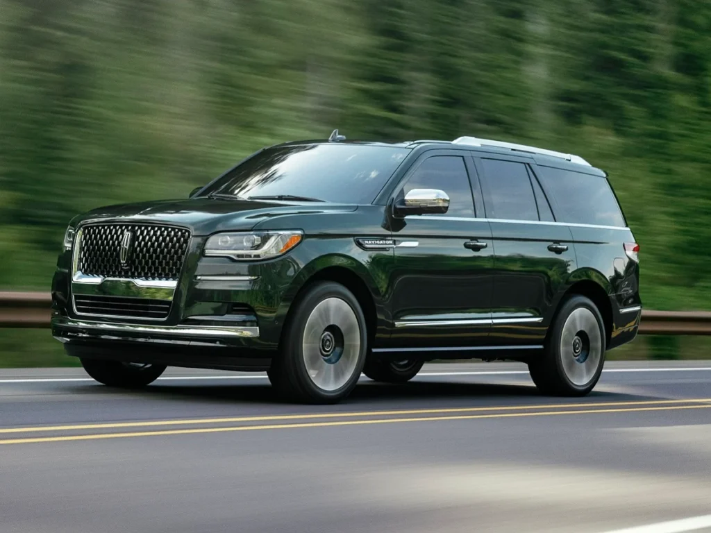 JDPA 2022 Lincoln Navigator Black Label Manhattan Green Front Quarter View in Motion 1 Most Reliable Luxury Suvs 2024: Reliable Picks That Redefine Endurance